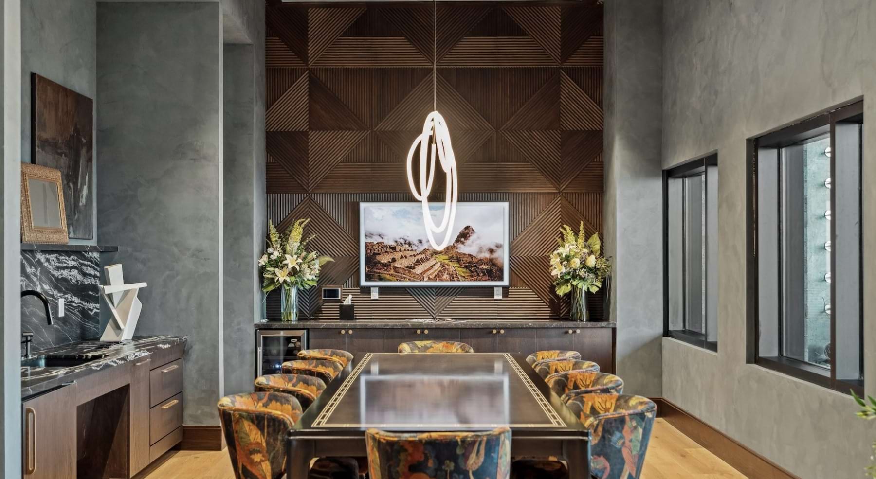 large dining table in clubhouse with stylized lighti